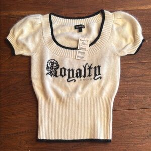 bebe Royalty Cream Knit Top with Black and Rhinestone Accents